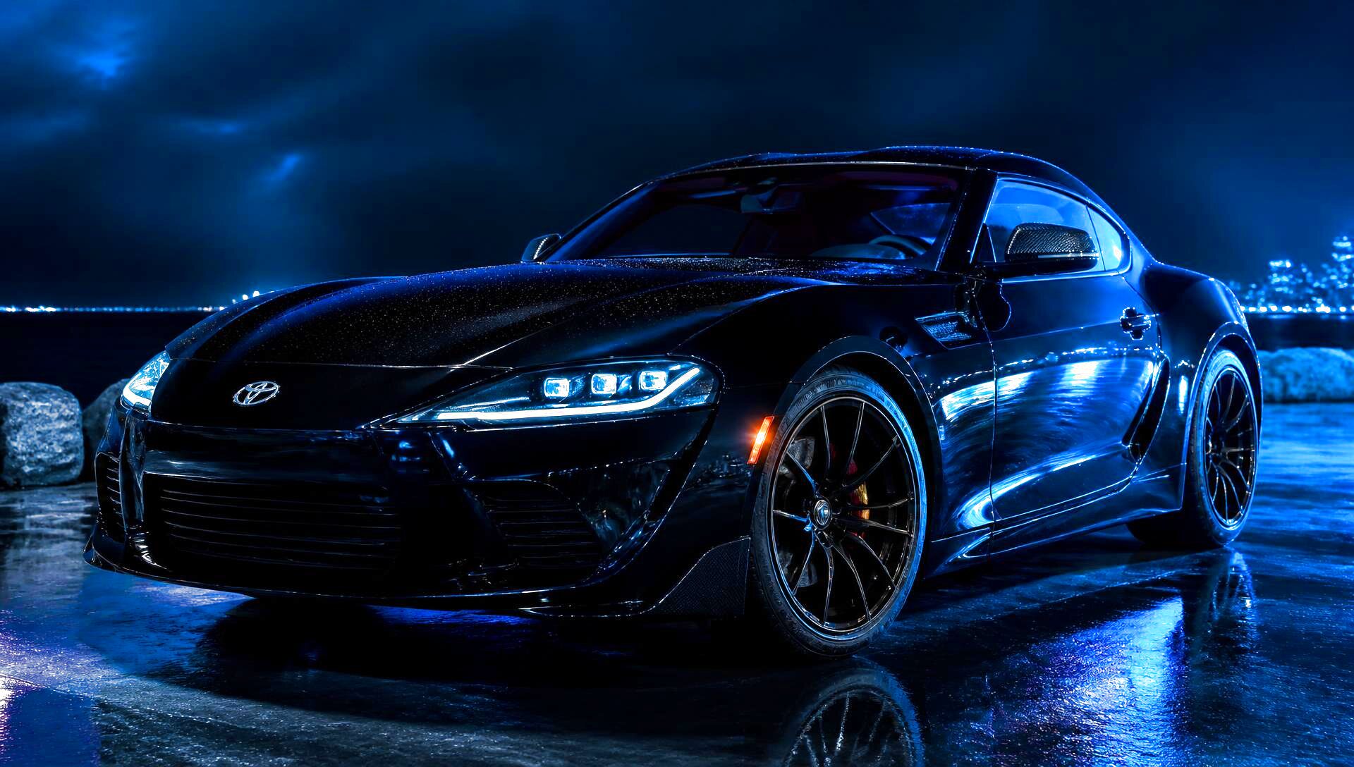 Freshly detailed glossy black sports car with mirror paint reflections after a PacificBreeze mobile detail